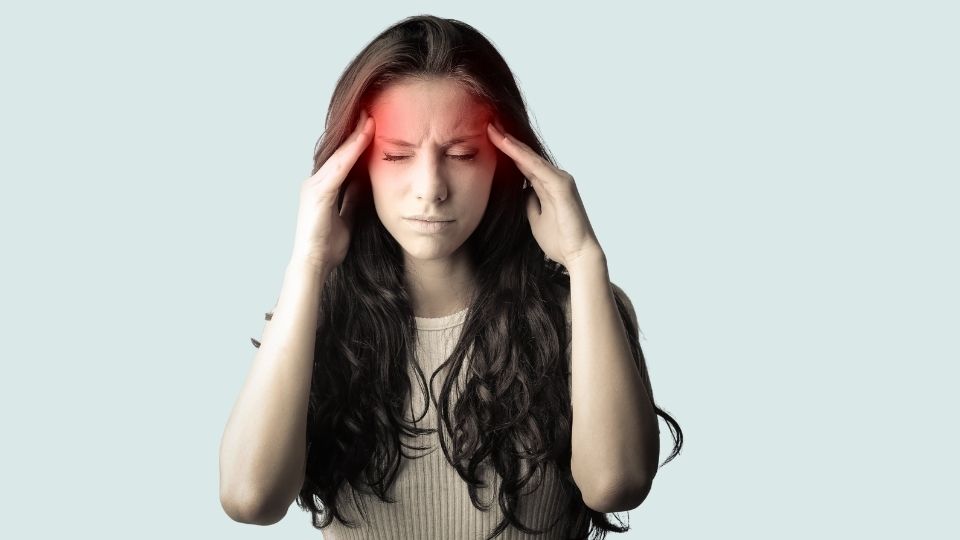 Woman With Headache Holding Head In Omaha